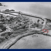 Grey scale aerial photo Macduff harbour area from circa 1930 with circled area to show the end of Rob Laing's pier.