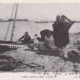 Grey scale postcard showing boat alongside Rob Laing's Pier, with various Lyall family members