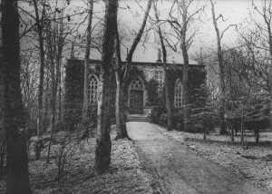 Black and white photo of the Mausoleum with trees and path in the foreground
