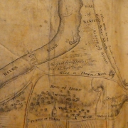 Photo of old yellowed map showing the River Deveron and the piers of the first Banff Bridge.