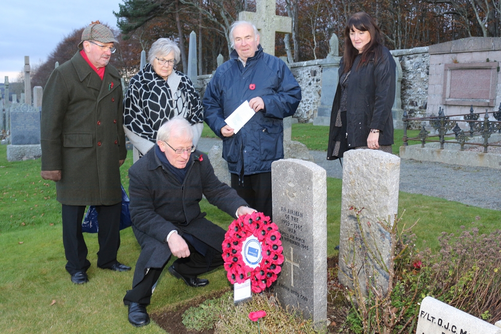 A wreath being laid on the grave of the unknown airman in Banff Cemetery