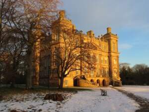 Image of Duff House bathed in winter sunshine with snow on the ground.